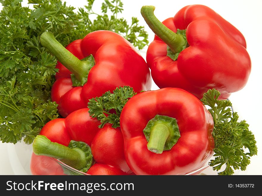 A group of Red Bell Peppers with parsley