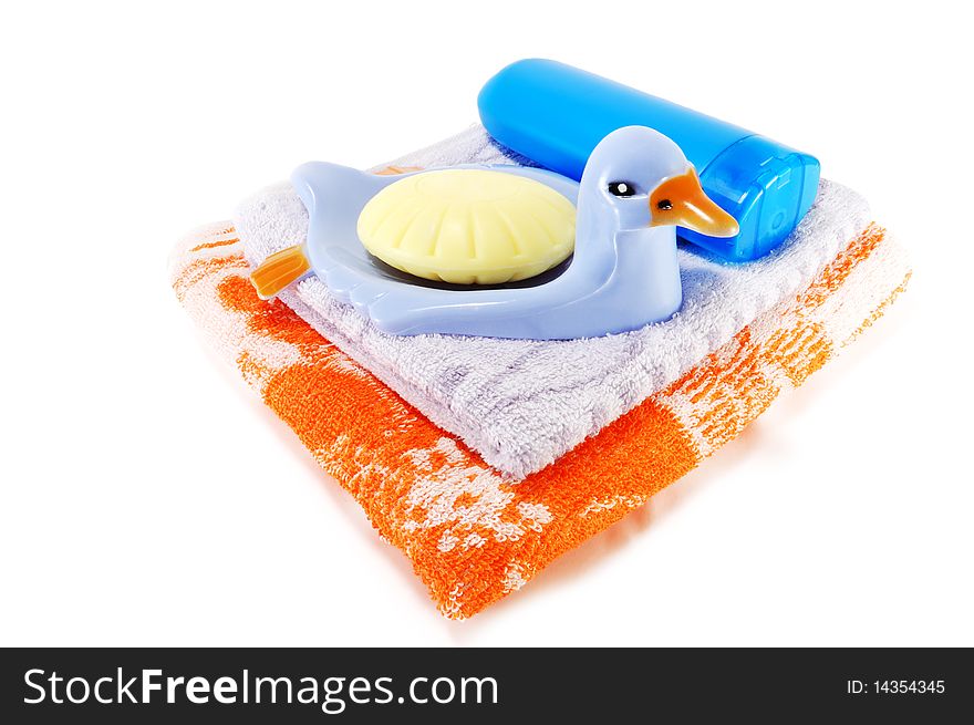 Towels, soap with soap dish isolated on a white background. Towels, soap with soap dish isolated on a white background