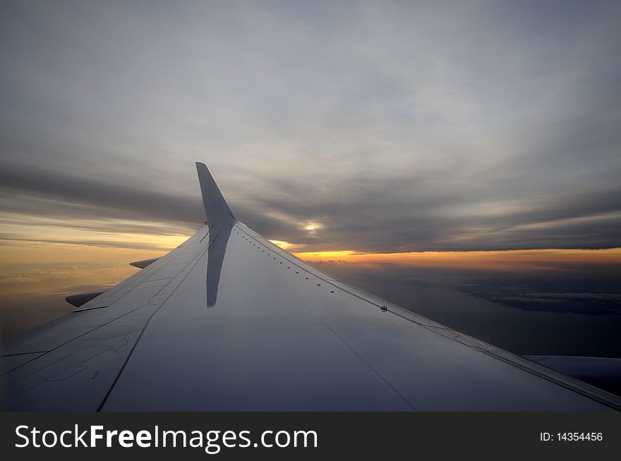 Wing of an airplane, sunrise