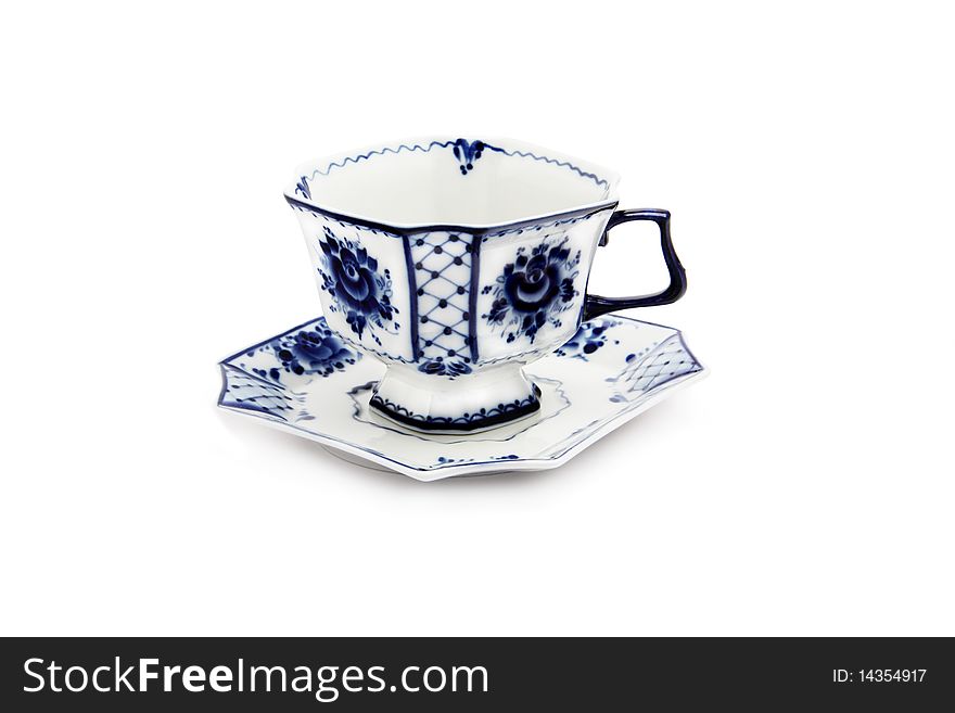 Cup and saucer by white and blue coloring, isolated