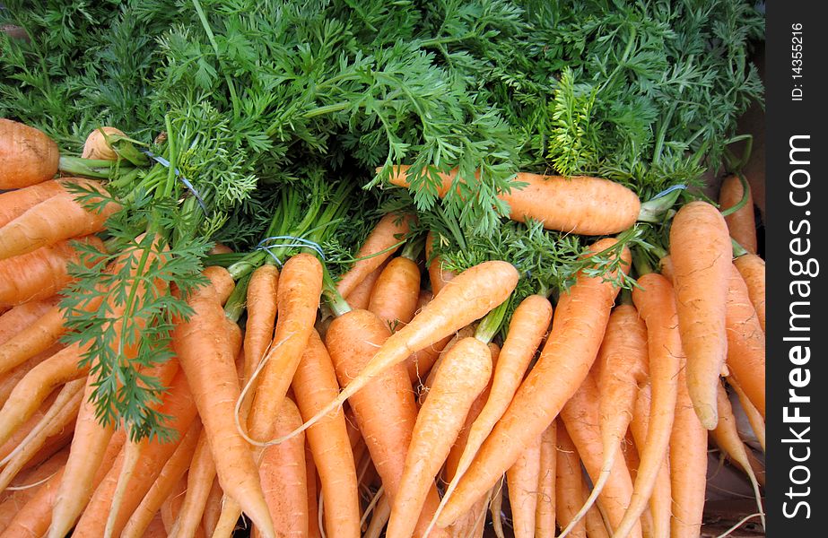 Fresh market carrots closeup background