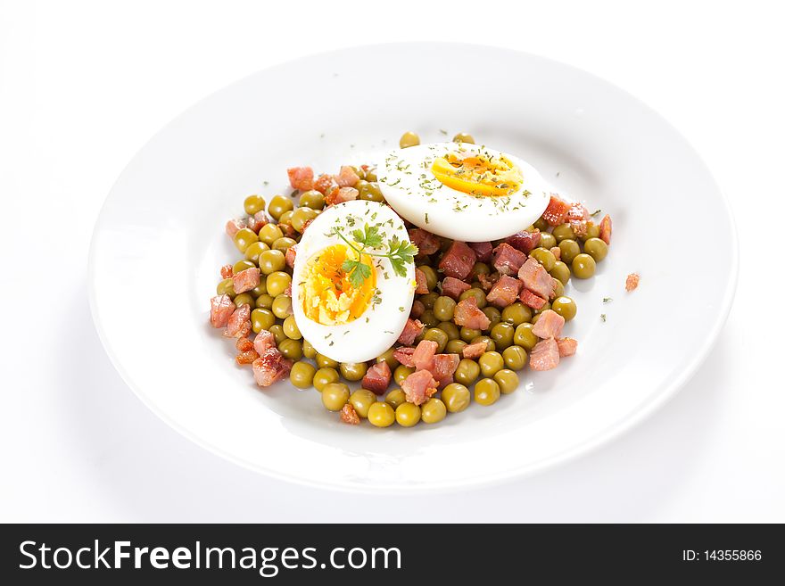 Tasty egg dish with ham and peas