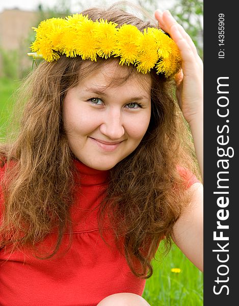 Attractive woman with dandelion diadem on her head. Attractive woman with dandelion diadem on her head