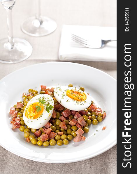 Tasty egg dish with ham and peas