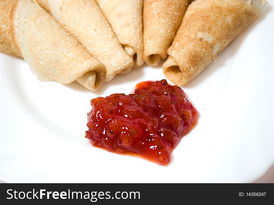 Tasty pancakes with jam ,in white background. Tasty pancakes with jam ,in white background.