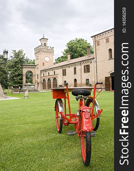 Red tricycle with ancient castle background. Red tricycle with ancient castle background