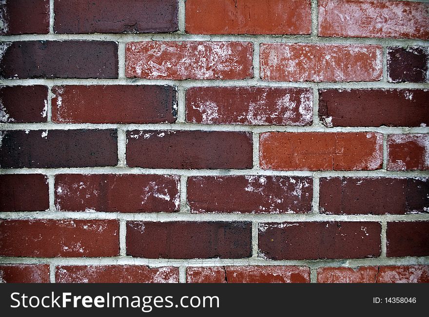 A brick exterior wall with various colors. A brick exterior wall with various colors.