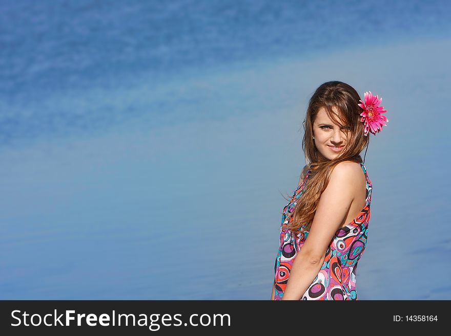 Young beautiful girl on sea background. Young beautiful girl on sea background