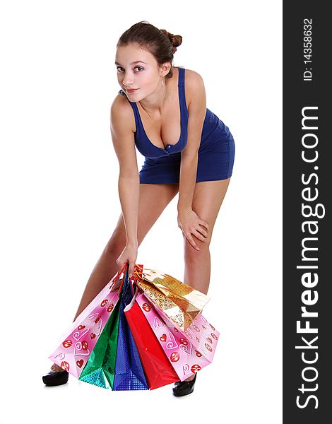 Shopping woman smiling. Isolated over white background