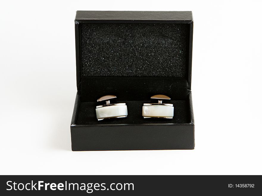 Elegant cufflinks made of metal and pearl, in a black box. Elegant cufflinks made of metal and pearl, in a black box