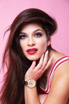 Free Cute Sexy Girl - Brunette In A Red Swimsuit Posing On A Pink Background Stock Photo - 143566350