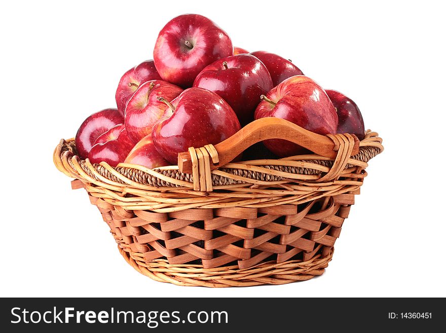The crop of apples is collected in a wattled basket, a background white. The crop of apples is collected in a wattled basket, a background white.