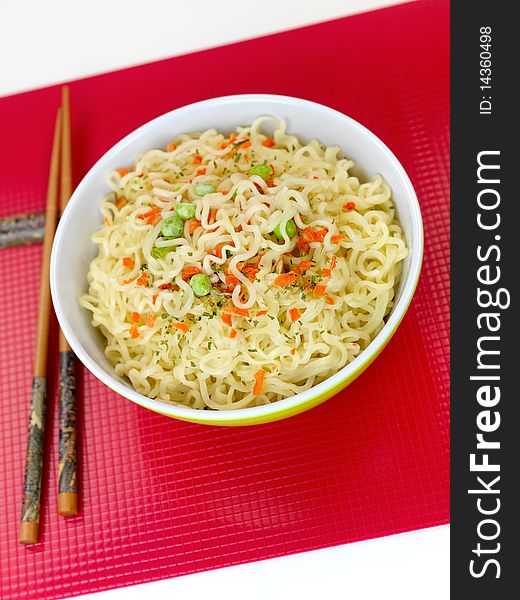 Cooked instant noodles isolated against a white background