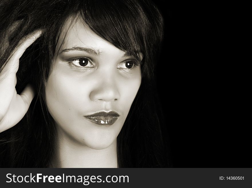 Beautiful young female model against a black background. Beautiful young female model against a black background