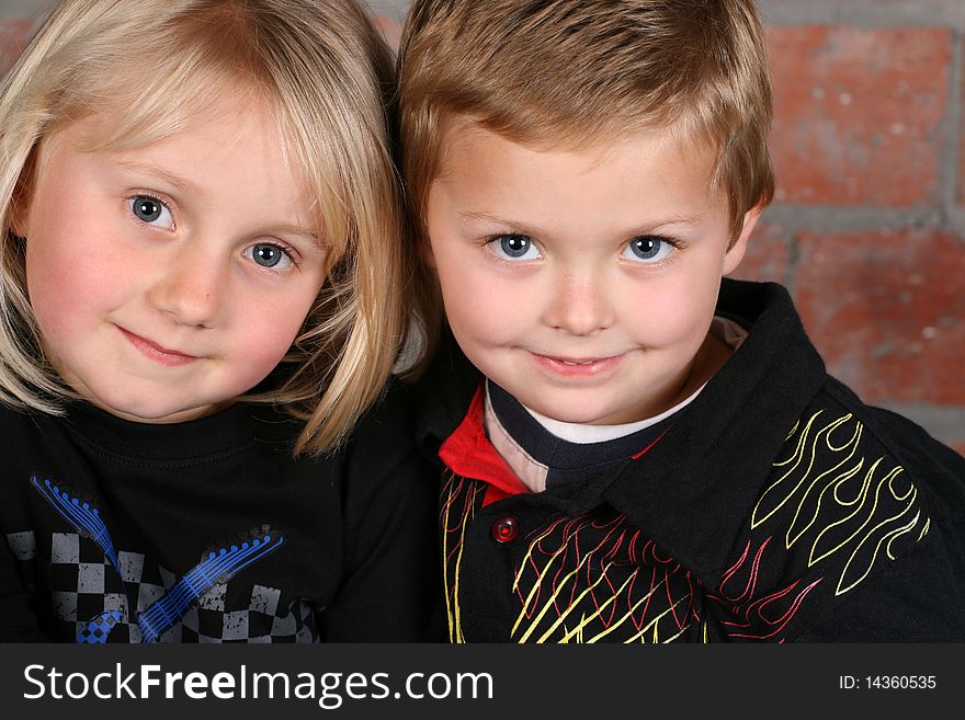 Beautiful young girl with blond hair and her cute boy friend. Beautiful young girl with blond hair and her cute boy friend