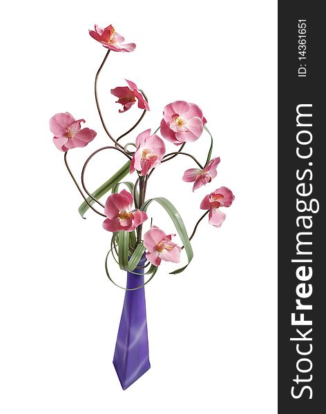 Artificial pink orchid flowers in lilac glass vase isolated on white background. Artificial pink orchid flowers in lilac glass vase isolated on white background