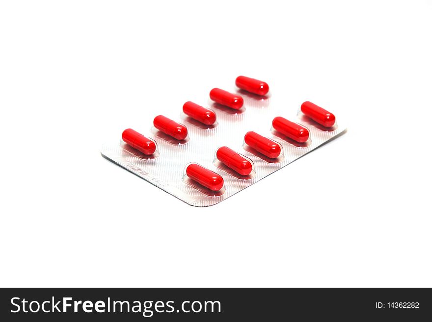 Photo of the packing of pills on white background