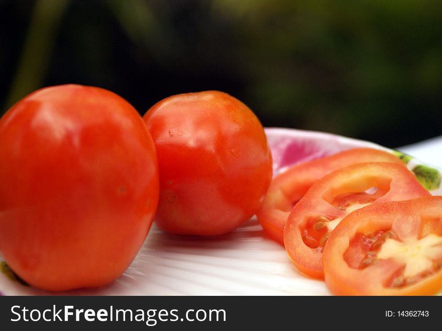 Two Red Tomatos And Slice