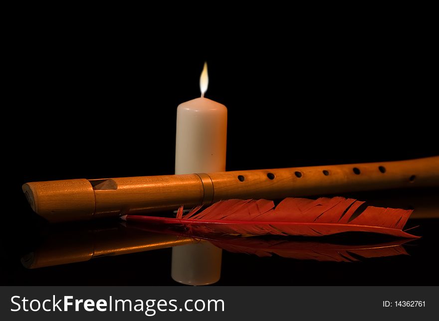 Still Life with flute, burning candle and red feather
