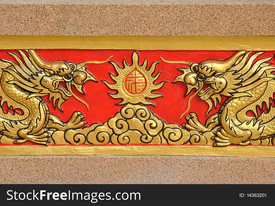 Golden dragon pattern carve on wall,thailand.