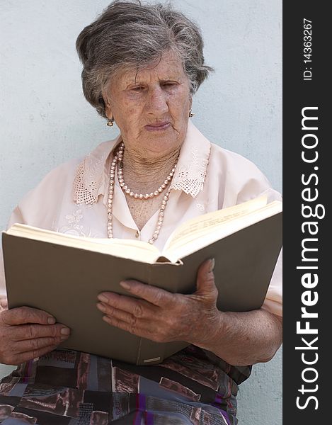 Old woman (85 years) reading book. Old woman (85 years) reading book