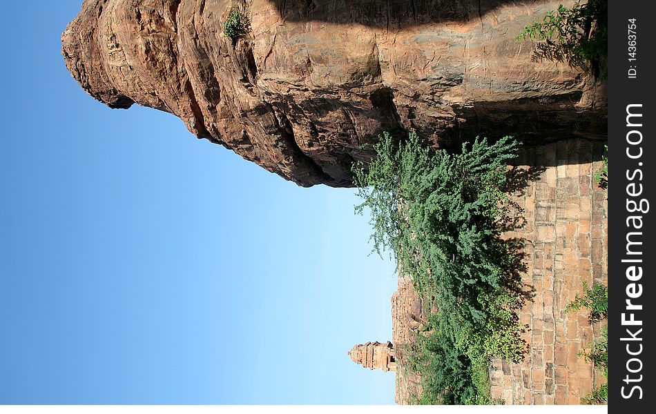 Tip of rock and temple tower on northern hill at Badami, Karnataka, India, Asia. Tip of rock and temple tower on northern hill at Badami, Karnataka, India, Asia
