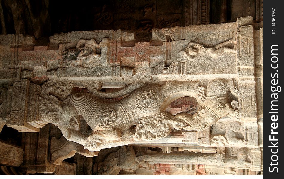 Carved designs on stone pillar at Krishna Temple in Hampi, Karnataka, India, Asia. Carved designs on stone pillar at Krishna Temple in Hampi, Karnataka, India, Asia