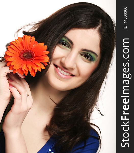 Young woman with gerber flower