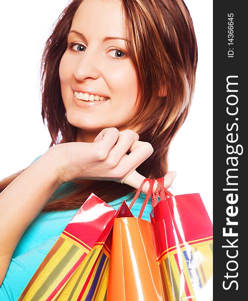 Shopping woman smiling. Isolated over white background