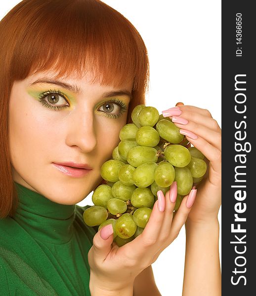 Close-up portrait of young attractive red woman with bunch of grapes. Close-up portrait of young attractive red woman with bunch of grapes