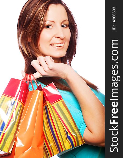 Shopping woman smiling. Isolated over white background