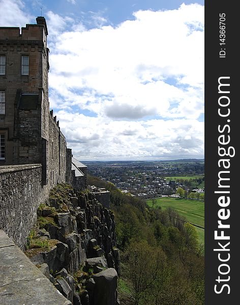 A steep rocky embankment and high wall defends Stirling castle from invaders. A steep rocky embankment and high wall defends Stirling castle from invaders