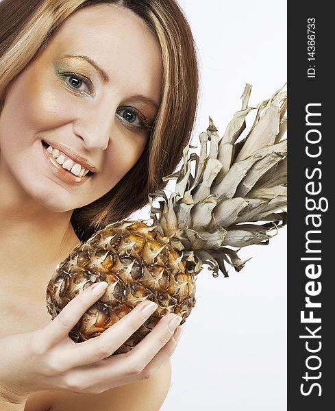 Young lovely woman  with pineapple