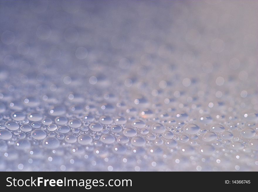 Small water drops background macro shot (shallow depth of field)