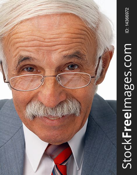 Close-up portrait of a happy elder businessman in the glasses. Close-up portrait of a happy elder businessman in the glasses.