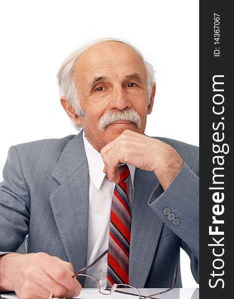 Close-up portrait of an elder businessman sitting thoughtful over white. Close-up portrait of an elder businessman sitting thoughtful over white.