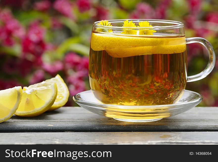 Herbal tea with lemon in the garden