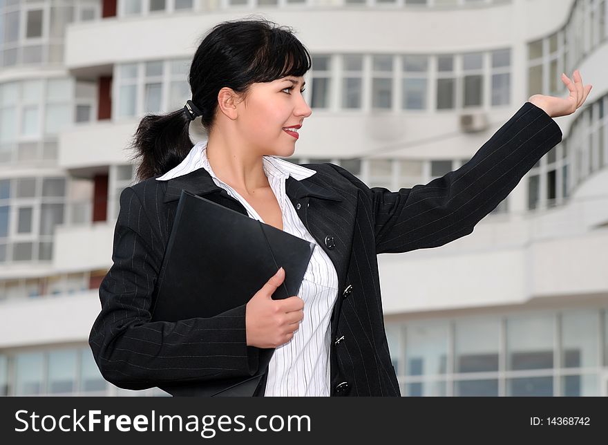 Young business woman at building