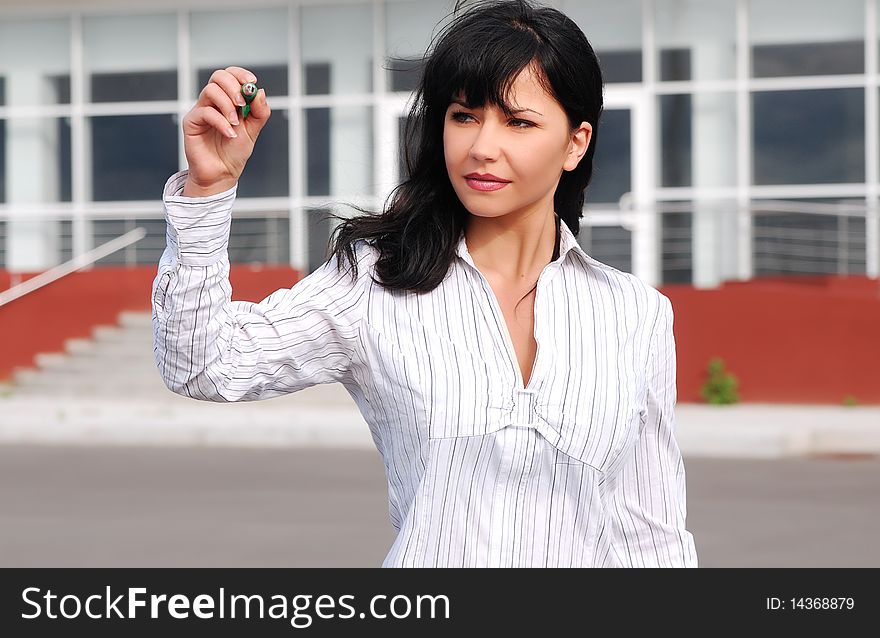 Young business woman with a pen