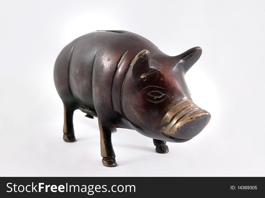 A bronze piggy bank on white background