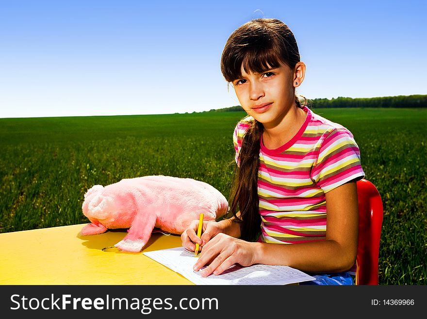 Girl At Table In Field