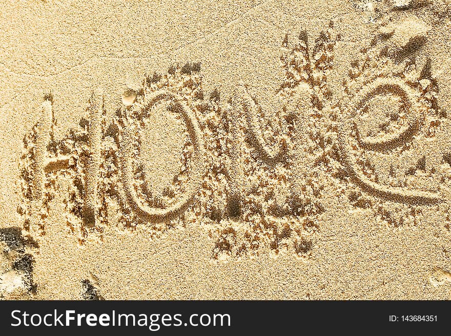 A Beautiful drawing on the sand of the sea background