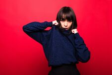 Cheerful Beautiful Young Woman In Sweater Over Red Background Royalty Free Stock Photo