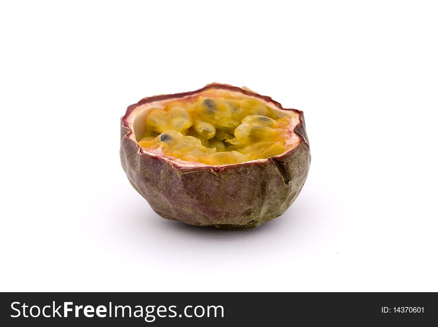Half a passion fruit isolated on a white background