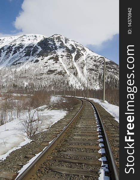 The railway leaving in snow-covered mountain. The railway leaving in snow-covered mountain