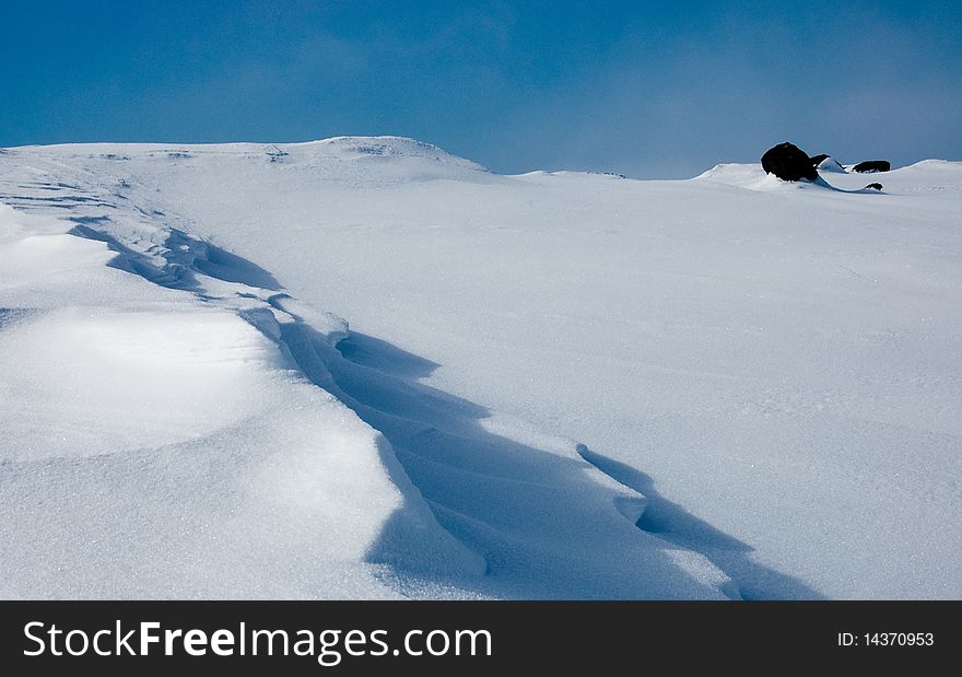 Abstract snow background. It is similar to the sea with floating dolphins. Abstract snow background. It is similar to the sea with floating dolphins