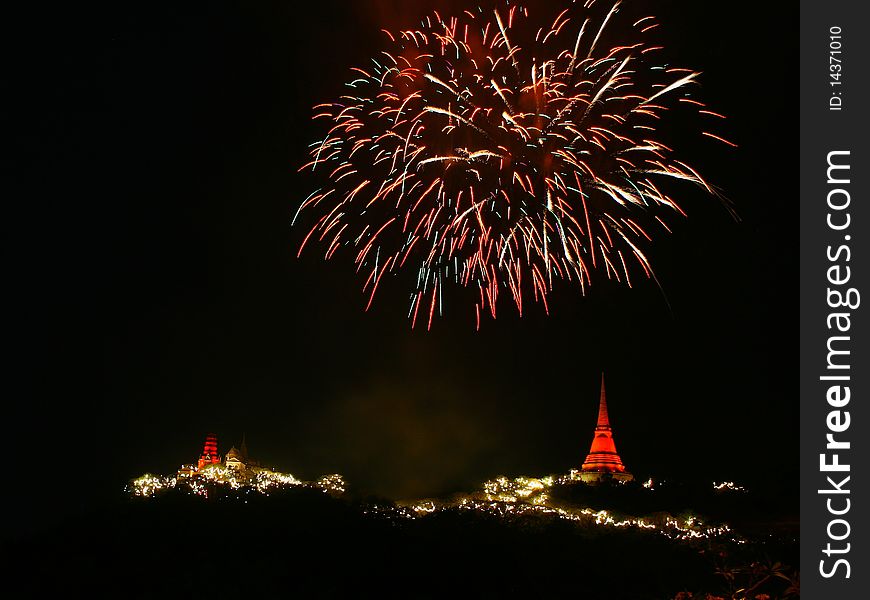 A photo of a fireworks with temple on the mountain, Thailand. A photo of a fireworks with temple on the mountain, Thailand