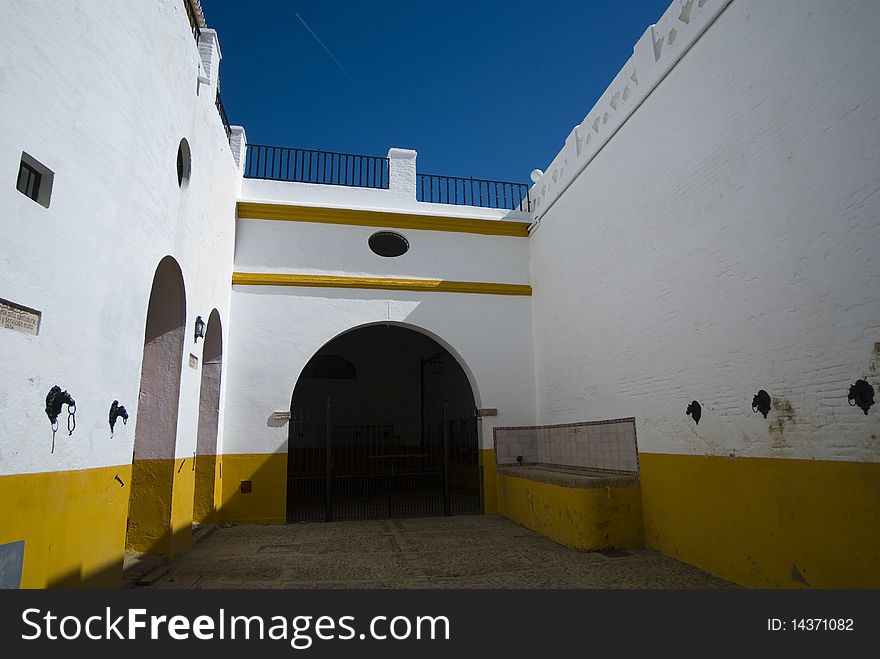 La Maestranza, white and yellow colors of the wall, makes the tones of the spanish flag. La Maestranza, white and yellow colors of the wall, makes the tones of the spanish flag