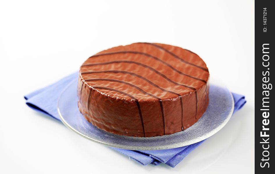 Nut cake glazed with chocolate icing - studio. Nut cake glazed with chocolate icing - studio