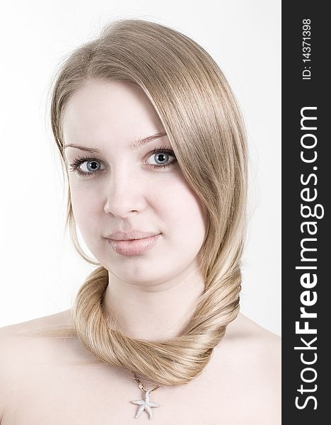 Closeup portrait of attractive young woman. Clean skin